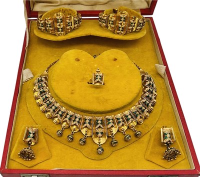 Lot An important parure of yellow metal and...