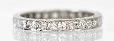 Lot 779A - A platinum and diamond eternity ring, with...