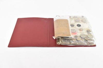 Lot 597 - An album containing various coins including...