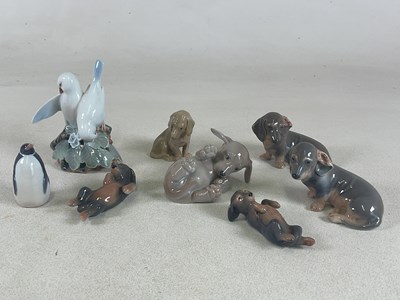 Lot 188 - ROYAL COPENHAGEN; porcelain figures of dogs...