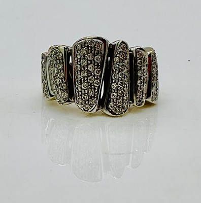 Lot 721 - An 18ct white gold and diamond set ring formed...