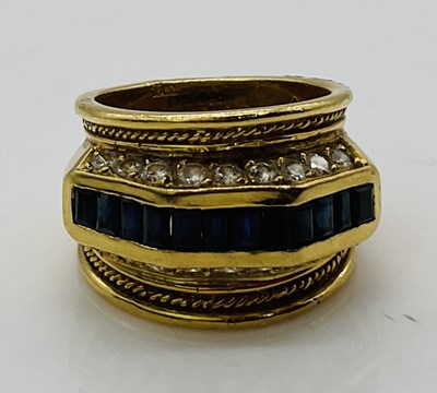 Lot 722 - An 18ct yellow gold sapphire and diamond ring...