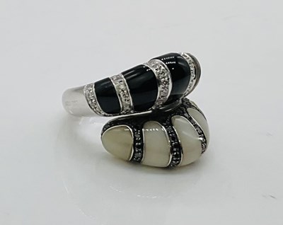 Lot 724 - A very unusual 18ct white gold white and black...