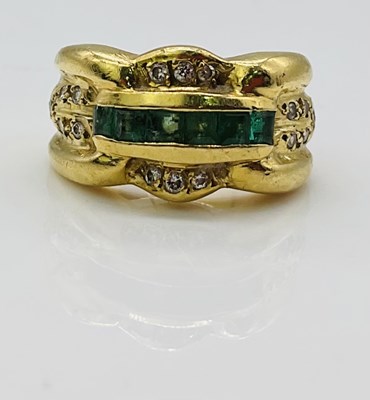 Lot 726 - An 18ct yellow gold diamond and emerald ring,...