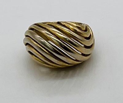 Lot 731 - A yellow metal pierced domed ring, stamped...