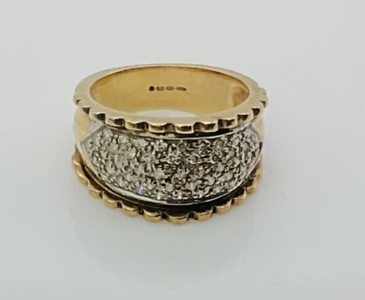 Lot 737 - A 9ct yellow gold ring, with shaped panel set...