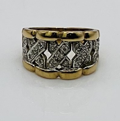 Lot 739 - A 9ct yellow gold ring, with pierced central...