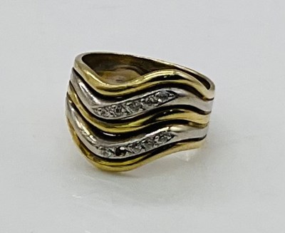 Lot 744 - A 9ct yellow and white gold diamond set ring,...