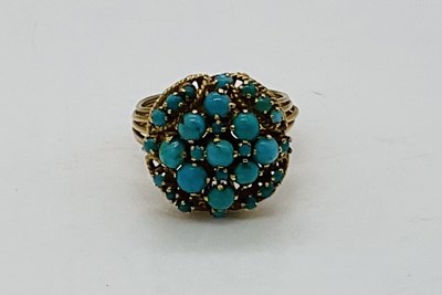 Lot 745 - A yellow metal turquoise set dress ring, with...