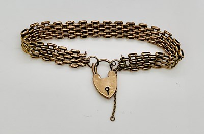 Lot 753 - A 9ct yellow gold bracelet with heart shaped...