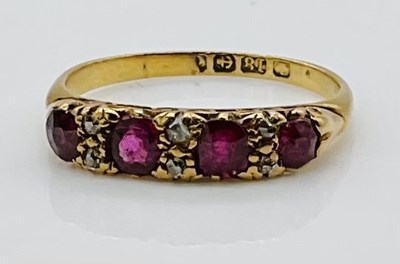 Lot 760 - An 18ct yellow gold ruby and sapphire ring,...