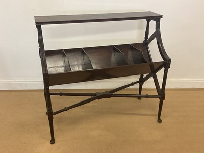 Lot 383 - A mahogany book trough, raised on ring turned...
