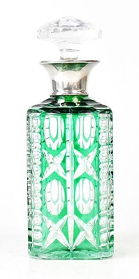 Lot 216 - A cut gut glass decanter with green overlay...