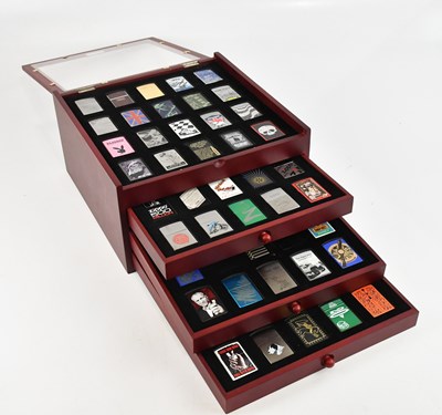 Lot 357 - ZIPPO; a set of eighty lighters, housed in...