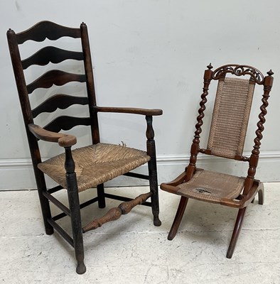 Lot 194 - A 19th century ladderback elbow chair with...