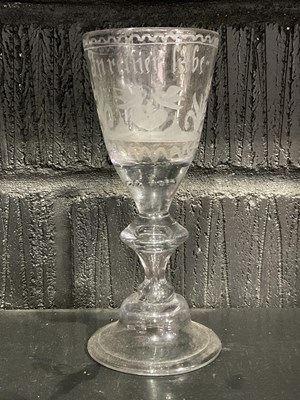 Lot 435 - An 18th century German wine glass with folded...