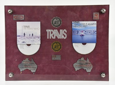 Lot 1820 - TRAVIS; a framed montage produced by the...