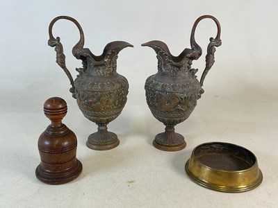 Lot 314 - A pair of ornately decorated brass ewers,...