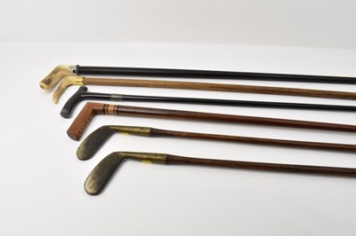 Lot 272 - A collection of four walking sticks and canes...