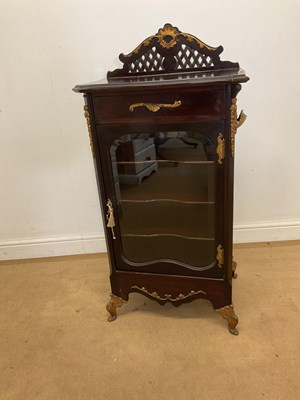 Lot 454 - A mahogany glazed music cabinet, fitted with...