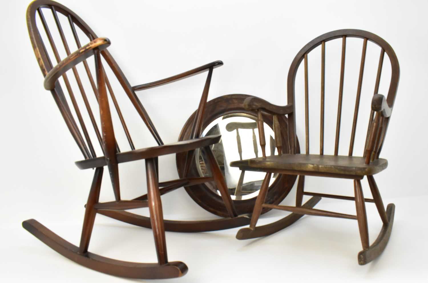 Lot 2 - A dark wood Ercol stick-back rocking chair, a...