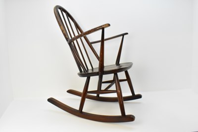 Lot 2 - A dark wood Ercol stick-back rocking chair, a...
