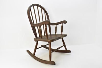 Lot 2 - A dark wood Ercol stick-back rocking chair, a...