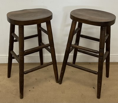 Lot 438 - A pair of oak bar stools, height 75cm.