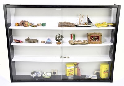 Lot 598 - A modern display cabinet with various objects...