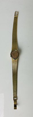 Lot 764 - A 14ct yellow gold watch bracelet, with...