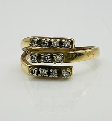 Lot 765 - A yellow metal eleven stone diamond set ring,...