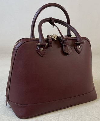 Lot 248 - ASPINAL OF LONDON; a burgundy Hepburn leather...