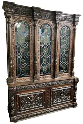 Lot 3 - A large 19th century carved oak bookcase, with...