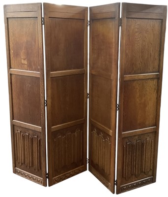 Lot 40 - A 1920s oak four section three-fold room...