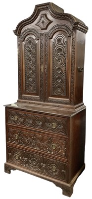 Lot 16 - An 18th/19th century carved oak bookcase, the...