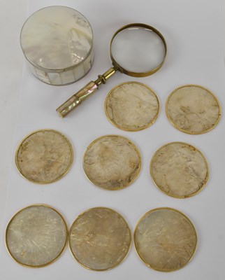 Lot 245 - A white metal mounted circular mother of pearl...