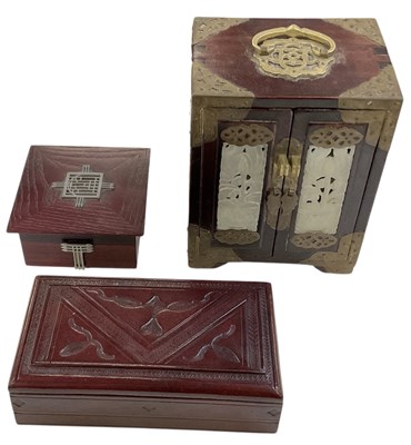 Lot 399 - A modern Chinese carved hardwood brass bound...