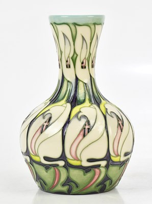 Lot 80 - EMMA BOSSONS FOR MOORCROFT; a squat vase with...