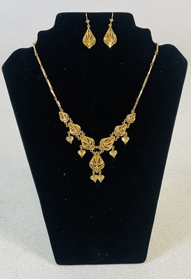 Lot 796 - A 21ct gold Middle Eastern necklace, length 42....