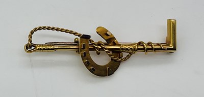 Lot 798 - A 15ct yellow gold brooch in the form of...