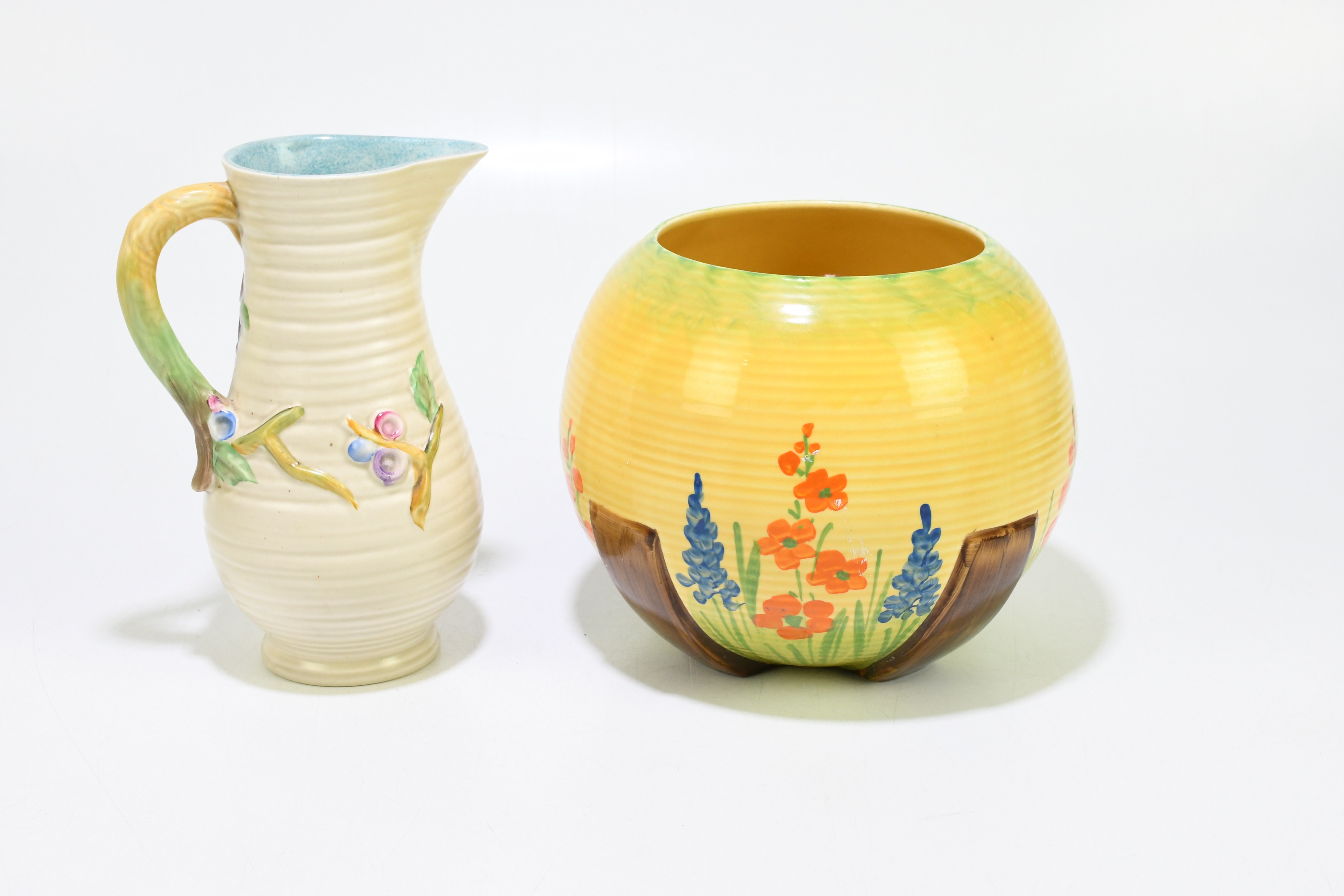 Lot 213 - MYOTT & SONS; an Art Deco vase with hand