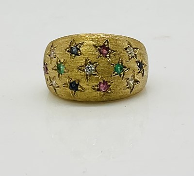Lot 805 - An 18ct yellow gold diamond, emerald, sapphire...