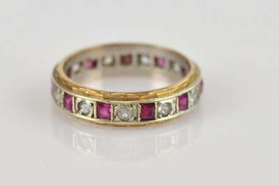 Lot 520 - A 9ct gold eternity ring set with square cut...