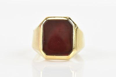 Lot 508 - A gold signet ring with lozenge shaped bezel...