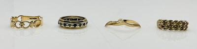 Lot 835 - Four 9ct yellow gold rings, combined approx...