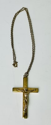Lot 842 - A 9ct yellow gold crucifix, length including...