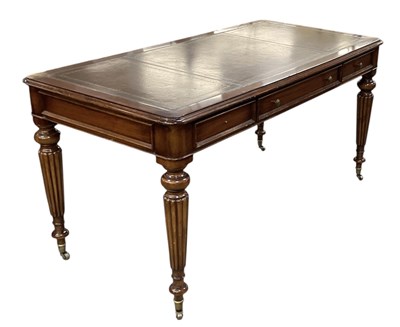 Lot 17 - A reproduction mahogany three drawer writing...