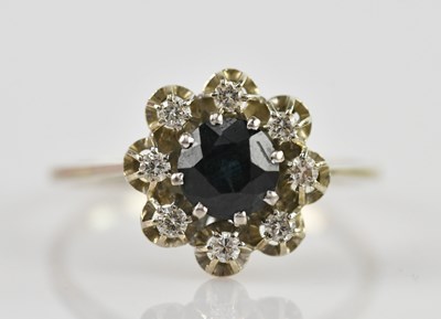 Lot 503 - A white gold sapphire and diamond ring, the...