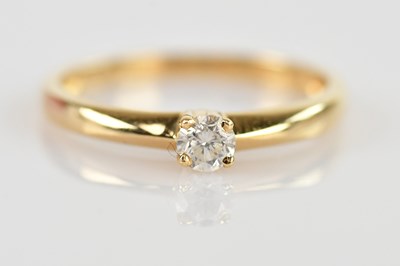 Lot 504 - An 18ct gold small diamond claw set solitaire...