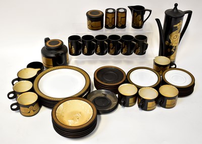 Lot 211 - HORNSEA; a gilt decorated black ground dinner...